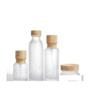 Förpackningsflaskor Frosted Glass Jar Lotion Cream Round Cosmetic Jars Hand Face Pump Bottle With Wood Caper Cosmeti Drop Delivery O DH4ZX