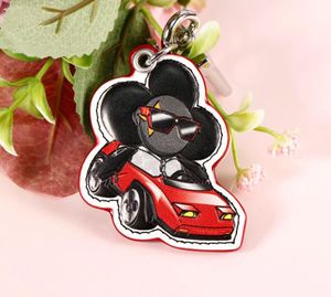 2023 New fashion boutique male and female mascots leather luxury keyring