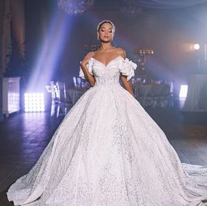 Luxury Ball Gown Wedding Dresses Sleeveless V Neck Beaded Sequins Shiny 3D Lace Pearl Appliques Formal Dresses Ruffles Bridal Gowns Plus Size Vestido de novia Custom