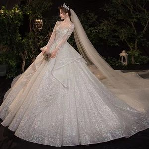 2023 I più nuovi abiti da sposa in pizzo a maniche lunghe di lusso con maniche lunghe Illusion Top Abiti da sposa in pizzo con perline Vestido De Noiva Abiti da sposa