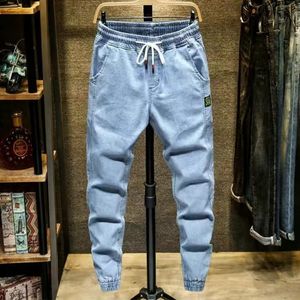 Мужские джинсы зимняя стройная подходная модная джинсовая джинсовая ткань растягивает брюки бренды черный синий 230211