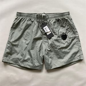 Novo 2024 shorts shorts 5 cores lente qualidade plana náilon roupas tingidas shorts de grife de secagem rápida natação cp marca shorts