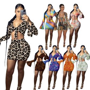 Kvinnors tvåbitar byxor Sexig mesh -tryck Set Women Flare Sleeve Bandage Crop Top Bodycon Mini kjolar för Summer Party Club SetSwomen's