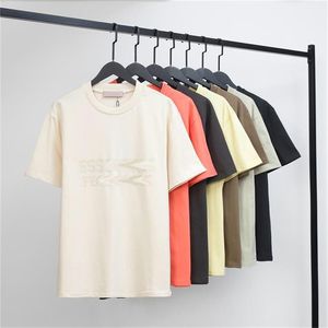 夏の新しいカップルTシャツダブルラインフィルック印刷ハイストリートルーズ半袖ラウンドネックTシャツ男性と女性向け