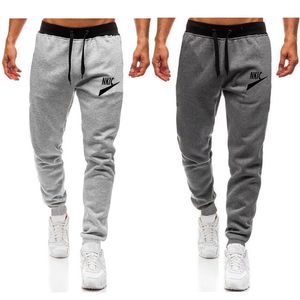 M￤ns jogging tr￶jor som k￶r manlig sport fitness sportkl￤der andningsbara byxor homme casual bomullsbyxor byxor varum￤rke logotyp