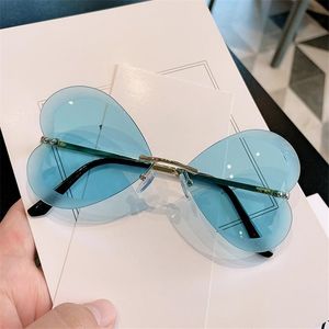 Solglasögon unika kantlösa hjärtglasögon kvinnliga ramlösa solglasögon damer Eyopiece Women Sunshade Butterfly glasögon Oculos