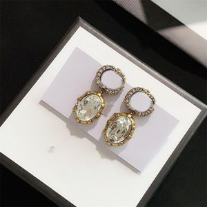 Designer ￶rh￤nge Bokst￤ver dubbel g logotyp ￶rh￤nge lyxiga kvinnor mode b￥ge smycken metall ggity crystal p￤rla ￶rh￤nge 354