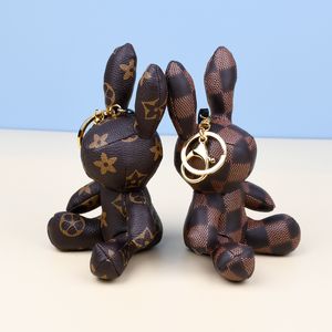 2023 Designer Key Rings Rabbit PU Leather Keychains Purse Pendant Car Keyring Chain Charm Brown Flower Mini Bag Tassel Gift for Men WomenAccessories