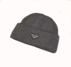 Winter designer caps luxury man hats creative metal triangle with letters cold wind proof warm delicate beanies modern designer knitted hat for ladies gentleman