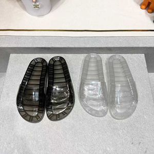 Slippare 2023 Design vår sommar Nya transparenta tofflor Fashion Plat Plastic Men's Women's Crystal Open-Toe Back tomma sandaler