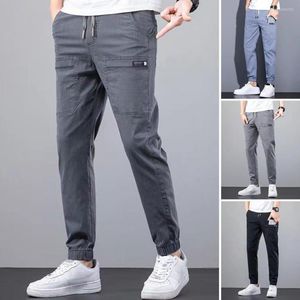 Herrbyxor män last fast färg multi fickor denim byxor hösten elastisk midja smal passform jeans mitt i dragstring