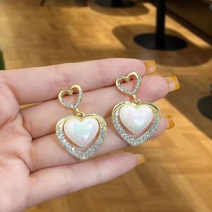 New Fashion OL Charm Mermaid Concubine Pearl Peach Heart Orecchini Temperamento Fashion High Sense Hollow Double Love Orecchini Femmina