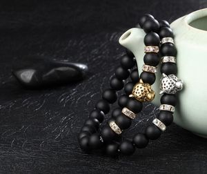 Braccialetti con ciondoli Macinazione di roccia lavica nera arenacea Filo di perline a mano Bracciale elasticizzato con coclea in cristallo di leone leopardato