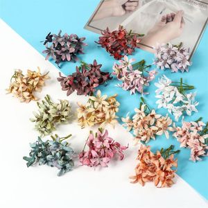 装飾的な花の花輪10pcs/セットシルククロス人工フェイクランフェイクフラワーヘッドDIYマグノリア植物ブーケ花輪装飾アクセス