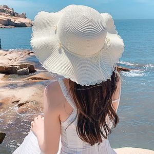 Billig designer fancy foldble sun hattar för kvinnor breda randen med en båge sommaren sombreros damer bohemia strand ua halmvisorer förpackningsbart fiske mössa