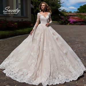 Abiti da festa Abito da sposa elegante Pizzo ricamato su rete con abito da ballo Treno O-Collo Nudo Manica intera Abiti da sposa Bottone Robes De Marie 230224