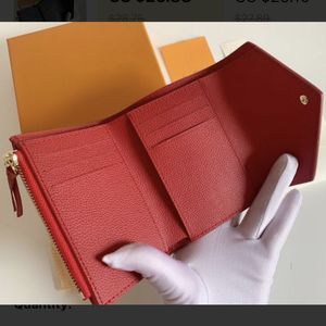 本革の女性の財布は、箱のエンボス加工されたレザーソリッドカラーショートウォレット281gで販売されています