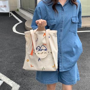 イブニングバッグキャンバスコントラストカラーレディースバッグファッション刺繍リボン肩女性2023大容量学生ハンドバッグセブン