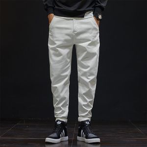 Jeans masculinos estilo japonês branco jeans de jeans de jeans straight solto tipo quatro estações calças 806men's