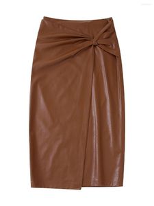 Kjolar kvinnor mode knuten front slits faux läder pu midi kjol vintage hög midja baksida med zipper kvinnlig mujer