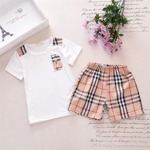 Completo di vestiti primaverili per neonato Camicia a maniche corte tascabile per bambina e ragazzo e pantaloncini scozzesi Completo da 1 a 7 anni Per bambini 2 pezzi