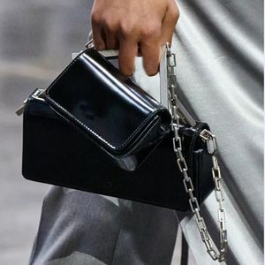 2023 First Sight Small rectangular flap bag Black leather mini bag embellished with a chain handle linked to an oversized metal F accessory clutch bags