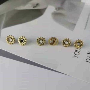 80% скидки дизайнерские ювелирные украшения кольцо кольцо асимметричные цветочные серьги делают подсолнечник старого стиля