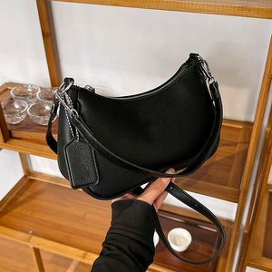 Barnd 23SS Day Packs New Dumpling Women's Handbags Moon Teeth Bun Simple Solid Letter Underarm Bun Single Shoulder Crossbody