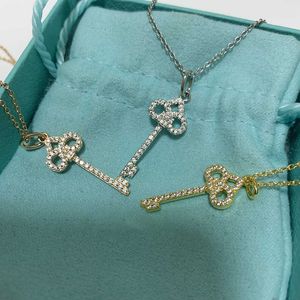 Designer Brand S925 silver clover small key necklace female gold round Tiffays lucky grass sweater chain diamond clavicle tide