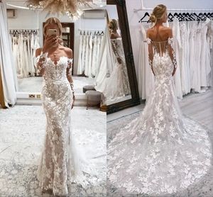 Splendidi abiti da sposa a sirena in pizzo Nuovi abiti da sposa sexy senza schienale con spalle scoperte maniche lunghe Appliques in pizzo 3D con bottoni ricoperti su misura