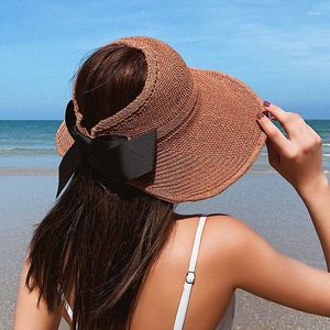 Cappelli a tesa larga Cappello di paglia coreano Protezione solare estiva da donna Top vuoto Viaggio da spiaggia Copricapo anti-ultravioletto Grande berretto pieghevole