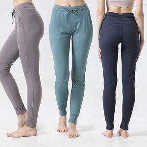 Kvinnor redo att byxor Yoga Beskable Casual Sports Pant -träning Kör långa byxor tränar utomhus överdimensionerade tröjor Wunder Train