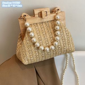 Factory wholesale ladies shoulder bags 3 colors small fresh woven handbag summer light straw chain bag elegant Pearl decorative fashion beach backpack 11175#