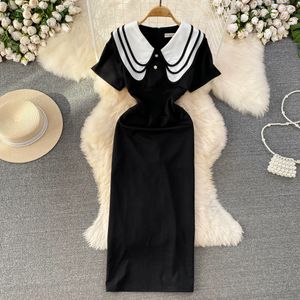 Sommar Franska Hepburn -stil Kontrasterande kortärmad dockhals med midjeband för bantningseffekt Split back wrap skinkor klänning elegant lång kjol