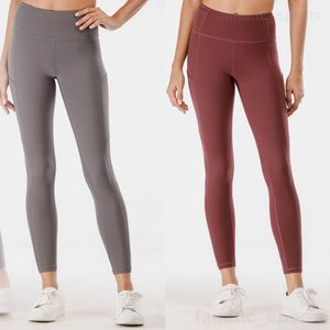 Lu Align Lu Lady Yoga Sport Legging Naked High Rise Tight Pants Tasche elastiche Bodybuilding Sweatpant Seamless Scrunch Pantaloni da allenamento Running Long Pant