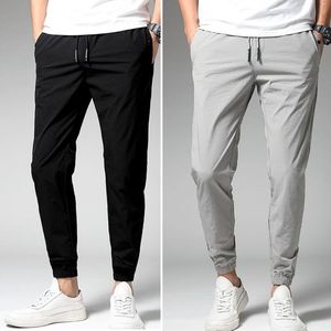 Calças masculinas 2023 calças de bolso de seda gelo de verão casuais jogging esportes moda ao ar livre largas roupas tamanho grande