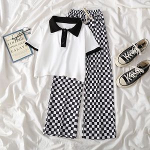 Kläder sätter flickor Junior Summer Suit Childrens Checkerboard Byxor Kort ärm Tshirt 2 -stycken Widelegged Pants 312Y 230608