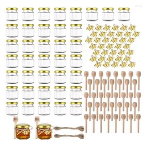 Bottiglie di stoccaggio 1.5OZ 60Pack Mini barattoli di miele di vetro esagonali con mestolo di legno Coperchi dorati Ciondoli ape Iuta Confezione da 60 perfetti per baby shower