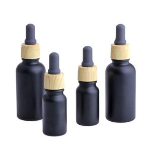 Bottiglia di profumo di olio essenziale di vetro nero opaco e liquido con contagocce pipetta reagente e tappo a grana di legno 10/30 ml Sglvx