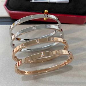 Fabrikpreis Großhandel 316L Edelstahl 18K Gold plattiert dünne Liebesschraubendreher Armband Armreifen