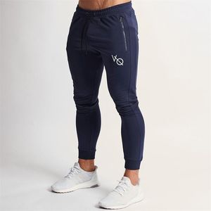 Calças Spring e Autumn New Fitness Men's Sports Pants Jogger Gym Gym Sportswear Zipper Pocket Cotton Casual Casual Calças