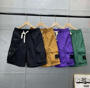 Casual Fashion Men's Shorts Multi Pocket Big Pocket Cargo Pants Summer Mens Beachwear Sweatpants Shorts Designer Compass broderade armbandpar Shorts