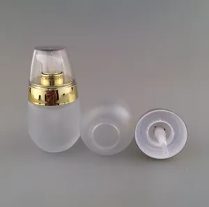 Großhandel 30 ml Lotionsflaschen aus Milchglas mit goldenem Deckel, klare 1-Unzen-Presspumpenflasche aus Glas, 30 ml-Kosmetikbehälter-Glasflasche aus Glas