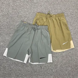 Ice Silk Shorts Męskie Summer Nowe luźne, szybkie, oddychające oddychające wszechstronne fitness na zewnątrz swobodne sportowe sporty przycięte spodnie