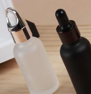 Оптовая матовая черная стеклянная бутылка с детской капельницей 20 куб.