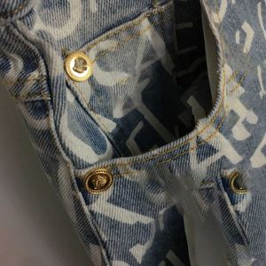 Designer kjolar kvinnor designer kläder 23ss nya fanjia gammal blommor bokstav metall dekorativ spänne wrap höft smal hög midja denim kort halv kjol kvinnkläder