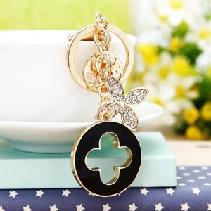 Nyckelringar Vackra Fourleaf Clover Keychain Utsökt metall Fashion Car Pendant Key Ring Women039S Bag Charm Gift3967678308Y