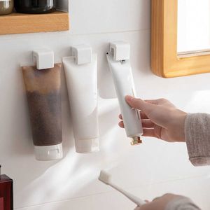 Novo clipe para pendurar no banheiro multifuncional para pasta de dente para banheiro rack de plástico para pasta de dente clipe para montagem na parede suporte organizador