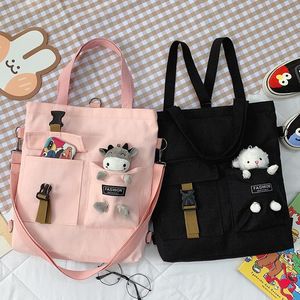 Kvällspåsar kawaii canvas shopping tygväska handväskor axel för tjejbok bolsa feminina mochila kvinnors ryggsäck med hänge