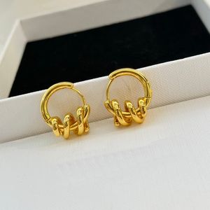 New designed TRIOMPHE Spring Knot hoops EARRINGS IN BRASS WITH GOLD SHINY WOMEN EAR HOOPS Designer Jewelry ER9008